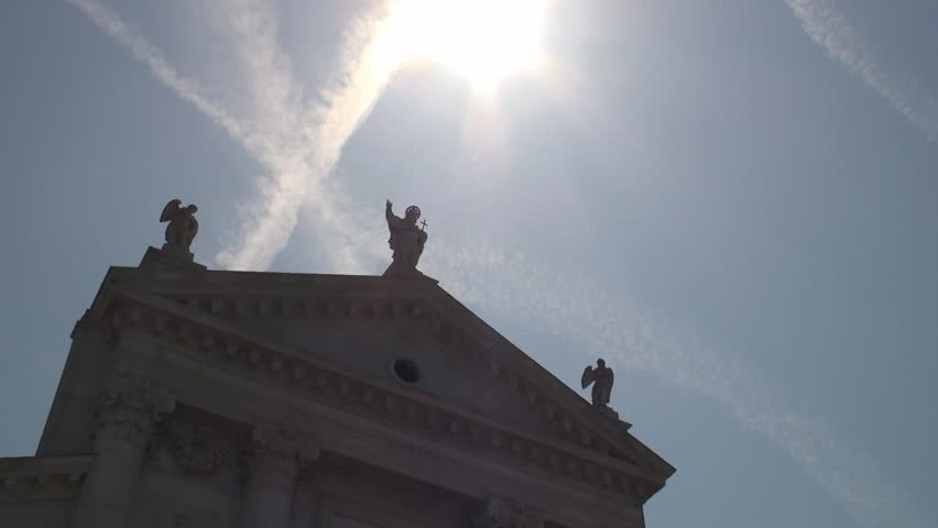 Backlit statue of Jesus on the Church of San Giorgio Maggiore, Venice