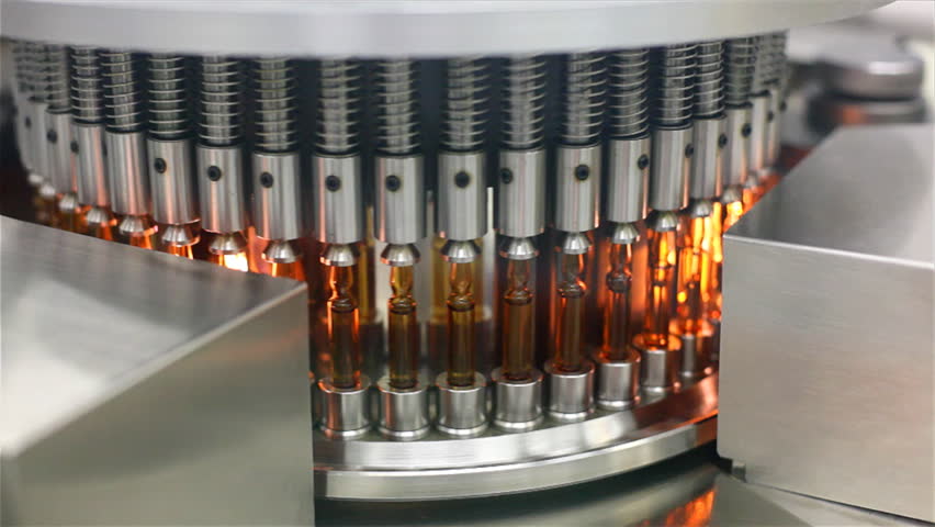 Automatic optical inspection machine, inspects vials and ampoules for particulates in liquid and container defects.
