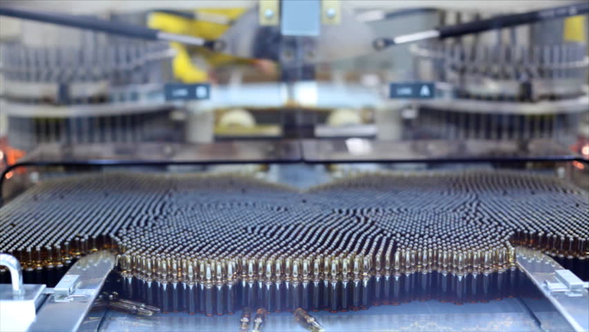 Automatic optical inspection machine, inspects vials and ampoules for particulates in liquid and container defects.