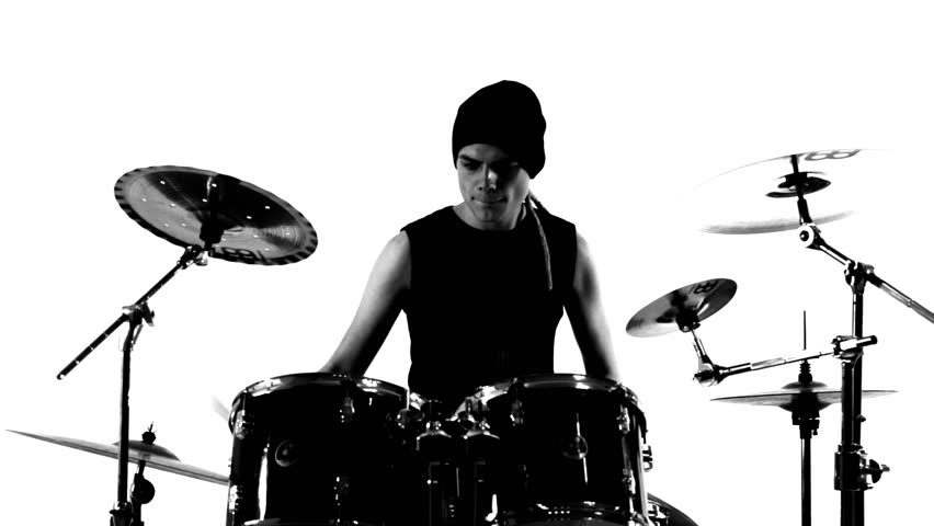 Drummer in a studio. Black and white video.
