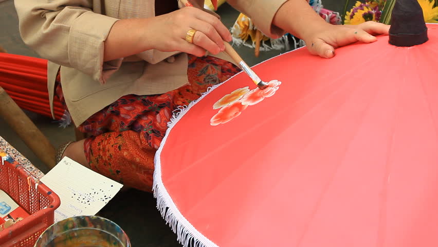 SAN KAMPHAENG, Thailand - JAN 13: Artist draws picture on umbrella, January 19,2013
At Bo Sang Village,Sankamphaeng,Chiang mai,Thailand.

