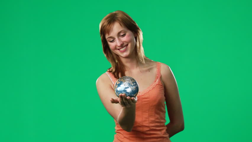 Chroma key footage of a woman holding a globe