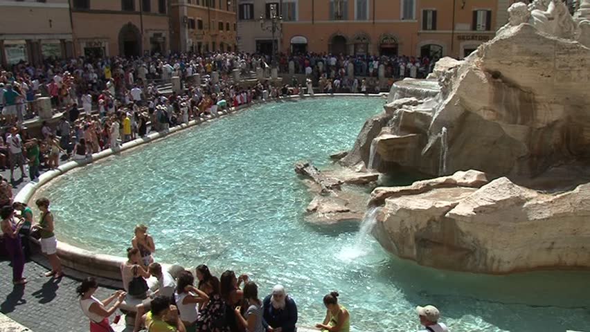 ROME - SEPT 04: Tourists in front of Fontana di Trevi on September 04, 2011 in Rome, Italy. Due to crisis Roman tourism is facing hard times dropping by more than 5% in comparison to 2008.
