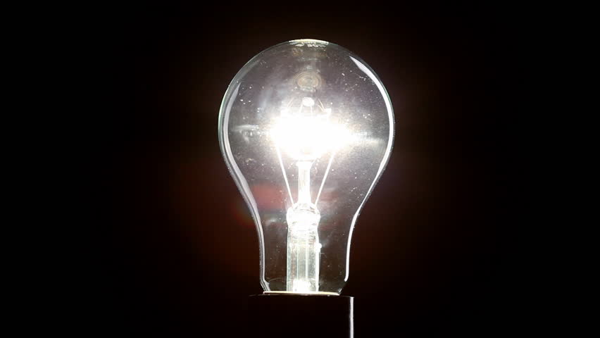 Light bulb on black background