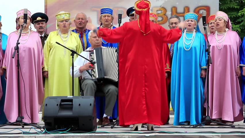 KIEV, UKRAINE, MAY 9, 2012: Holiday concert dedicated to the 67th Anniversary of victory in Great Patriotic War(World War II). Women in coloured costume sing Ukrainian song, Kiev, Ukraine, May 9, 2012