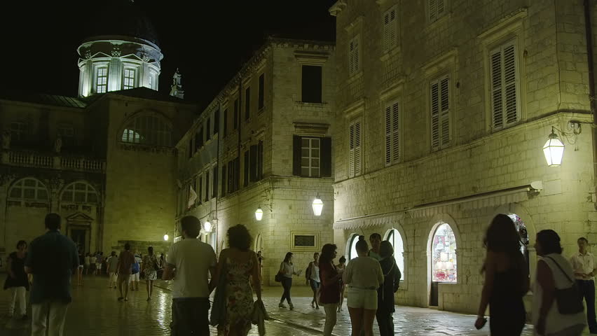 DUBROVNIK, CROATIA - SEPTEMBER 3 2012 - Summer atmosphere with tourists sightseeing and movement around caffe bar in front of Cathedral on September 3, 2012. in Dubrovnik, Croatia.