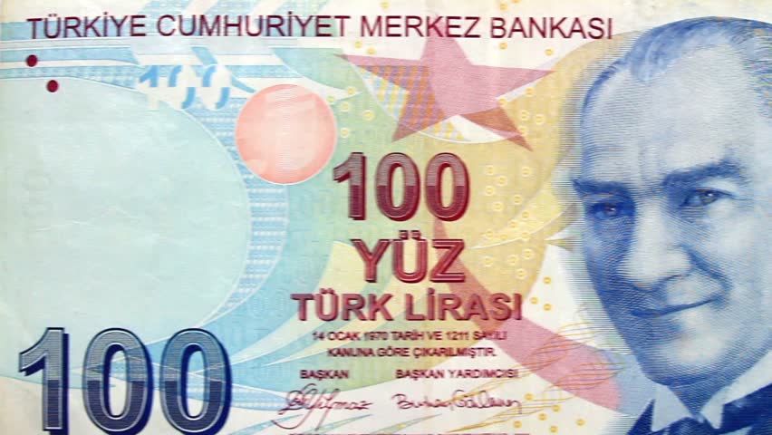Turkish Lira Banknote. Camera pans left to right over 100 Turkish Lira Banknote. 
