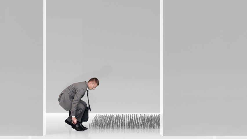 Businessman walking on nails in a white room, caution in business concept