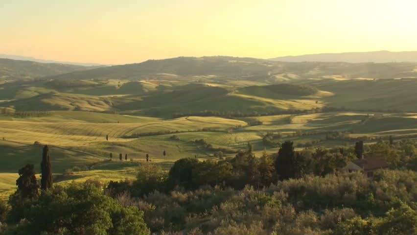 Val d'Orcia in the province of Siena in Tuscany, Italy at sunset