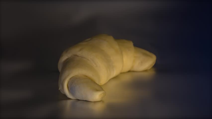time-lapse baking of single golden and crisp croissant