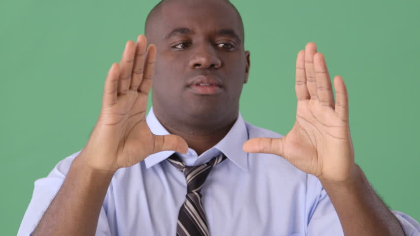 African American Businessman describing object to coworkers