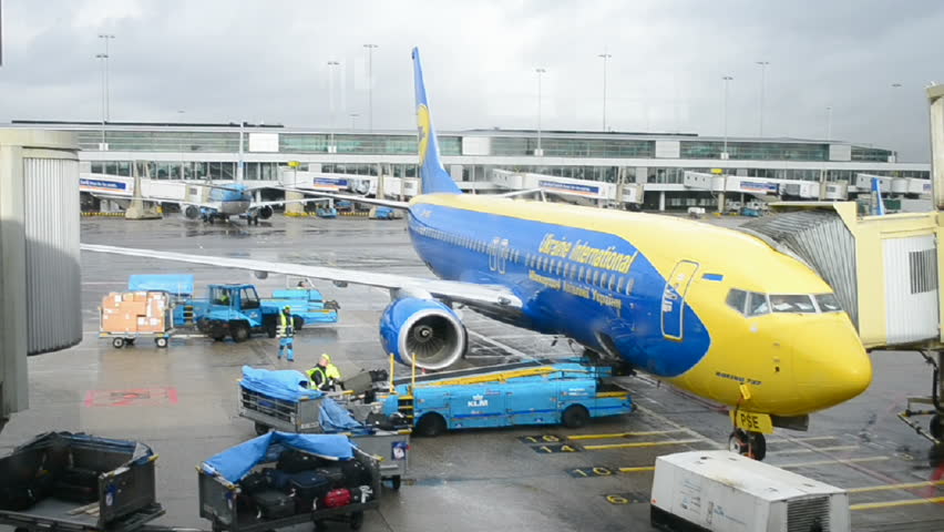 AMSTERDAM - JAN 31: Ukrainian airplane in Amsterdam Airport Schiphol on January 31,2013 in Amsterdam, Netherlands. Schiphol - one of the biggest European airports, it was open on September 16,  1916.