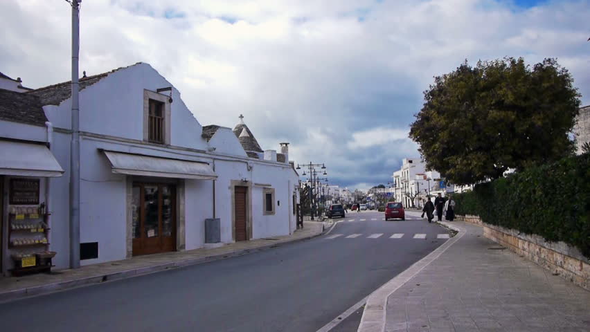ALBEROBELLO, ITALY - DEC 18: Trulli - traditional Apulia stone roof houses on December, 18, 2013, Alberobello, Italy. Alberobello is UNESCO World Heritage Site highly visited all year round