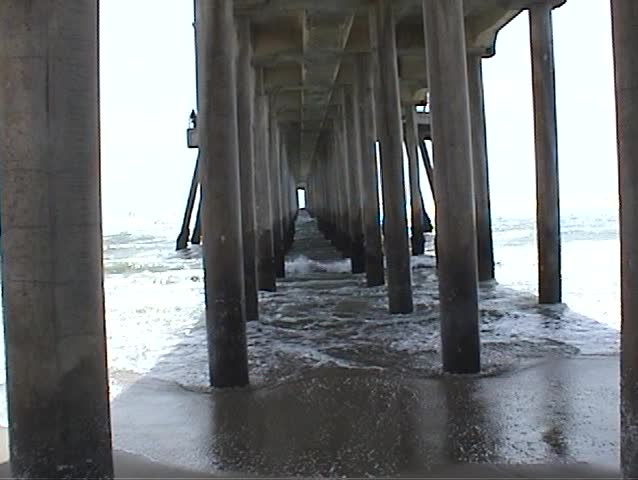 beneath the world famous Huntington Beach pier during heavy winds and rough seas With Sound
