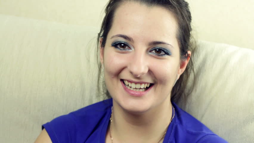beautiful young woman talking and laughing with friends