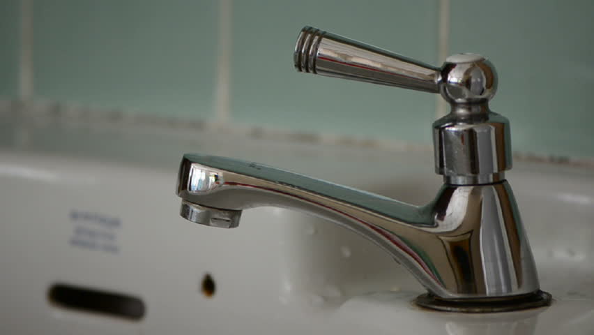 washing hand at basin