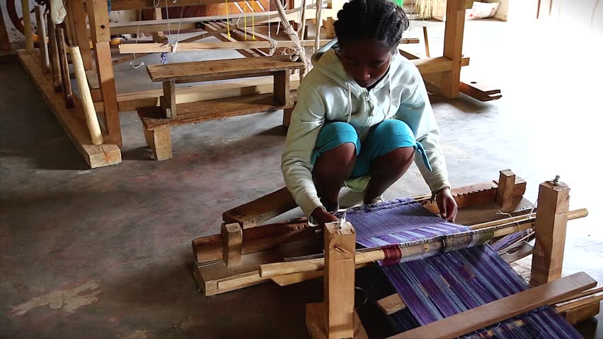 RANOMAFANA, MADAGASCAR - January 3: Local women exhibit new skill after training to weave in order to earn an income to survive and feed their families on January 3, 2013 in Ranomafana, Madagascar.