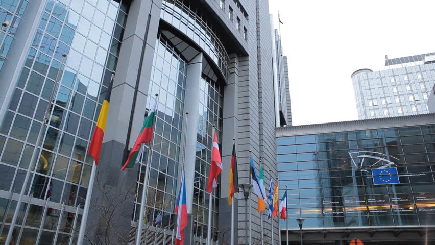 BRUSSELS, BELGIUM - DECEMBER 20: Flags in front of European Parliament Building in Brussels, Belgium on December 20, 2011.