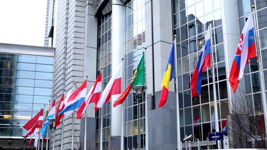 BRUSSELS, BELGIUM - DECEMBER 20: Flags in front of European Parliament Building in Brussels, Belgium on December 20, 2011.