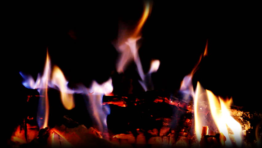 a nice log fire burning in a fireplace