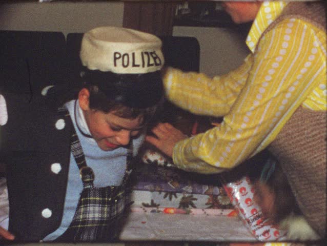 Vintage 8 mm film: Boy playing police man, 1970s