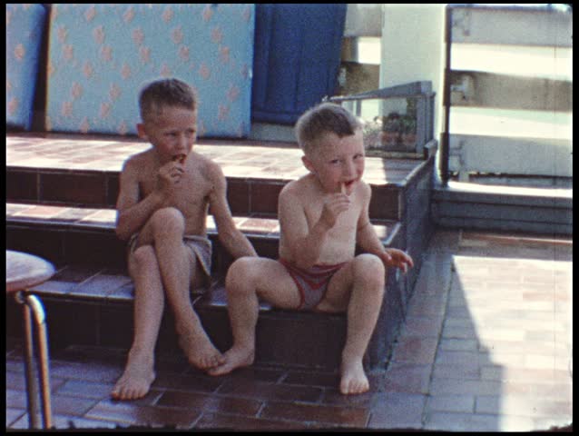 Little brothers sitting on balcony (vintage 8 mm amateur film)