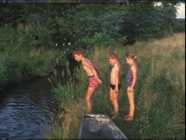 Vintage 8mm film: Children in bathtub on pond, 1960s