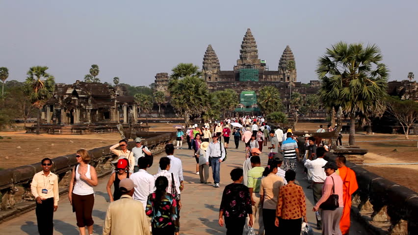 ANGKOR WAT, CAMBODIA - FEBRUARY 16, 2011 - People visit Angkor Wat Temple, Cambodia, The World's Largest Religious Building