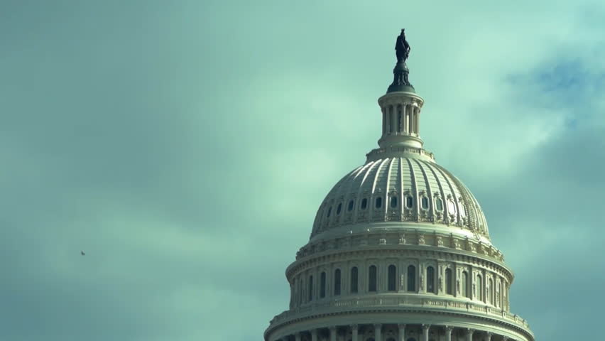 US Capitol dome on cloudy sky background close up time lapse