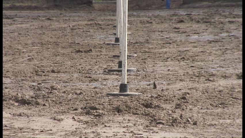 Horse and rider running poles straight on. Thirty second clip.