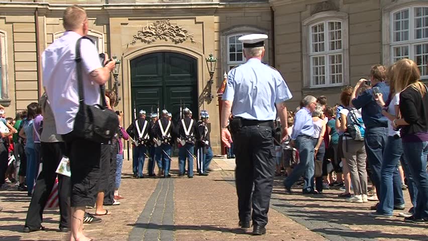 Copenhagen â AUGUST 4:  Royal Guards during the ceremony of changing the guards at Amalienborg Castle on August 4, 2011 in Copenhagen, Denmark