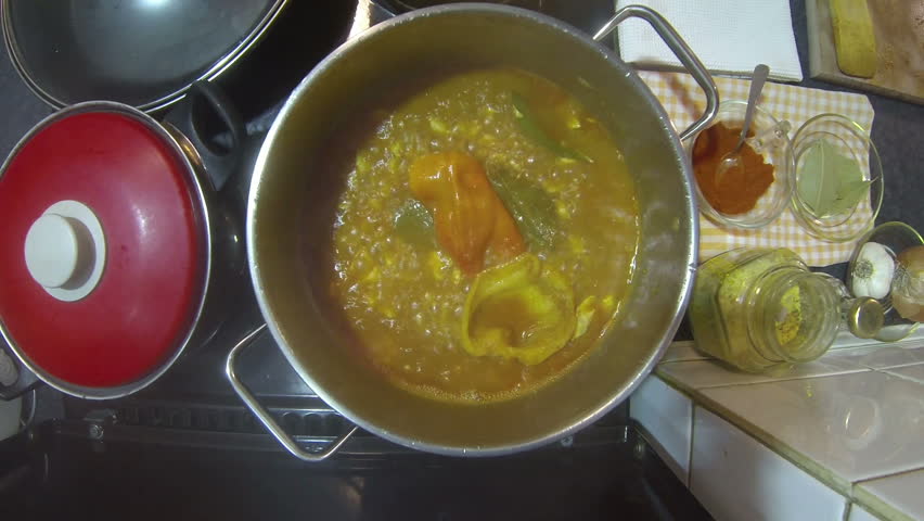 Chicken Stew With Potato.
Chef adding potato and water to chicken stew in a pot on stove. HD1080p.