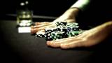 Poker playing placing a bet with chips.
