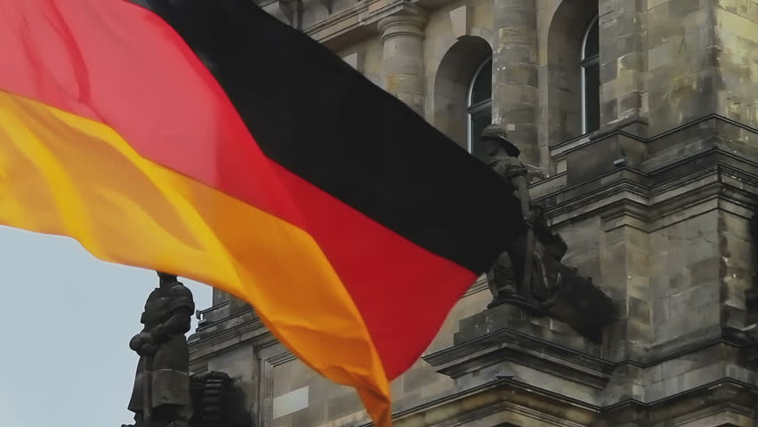 German flag waving in front of Parliament building in Berlin, close up