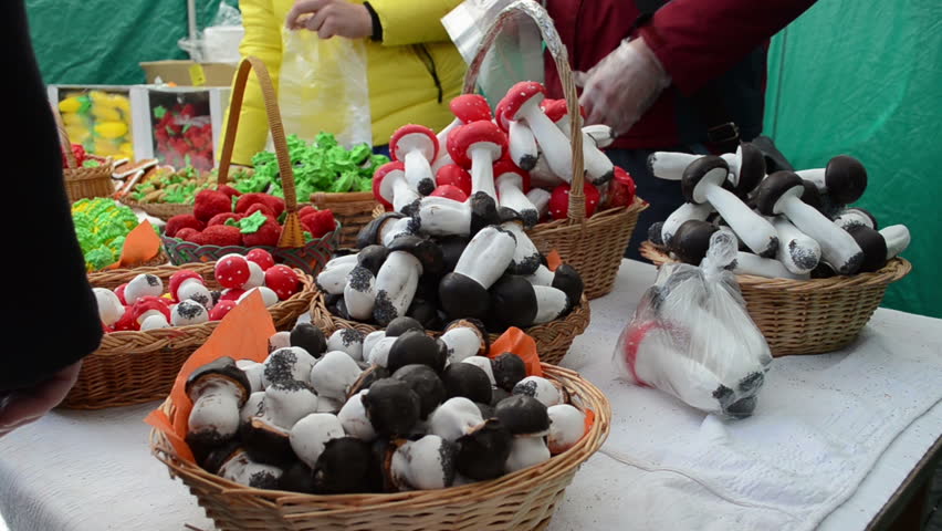 market vendors selling roasted doughy chestnuts mushrooms and other delicacies in spring fair