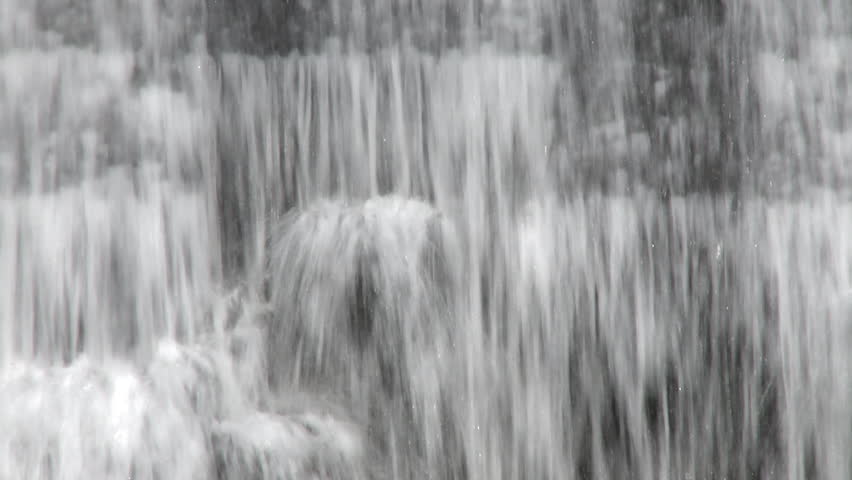 Curtain of water falling over a dam