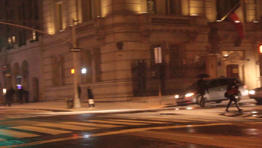 New York, NY - Circa 2012: Night traffic in Snow Fall during a blizzard with cabs and buses speeding down the street
