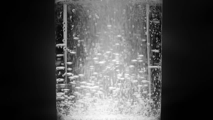 Aspirin tablet in glass of water