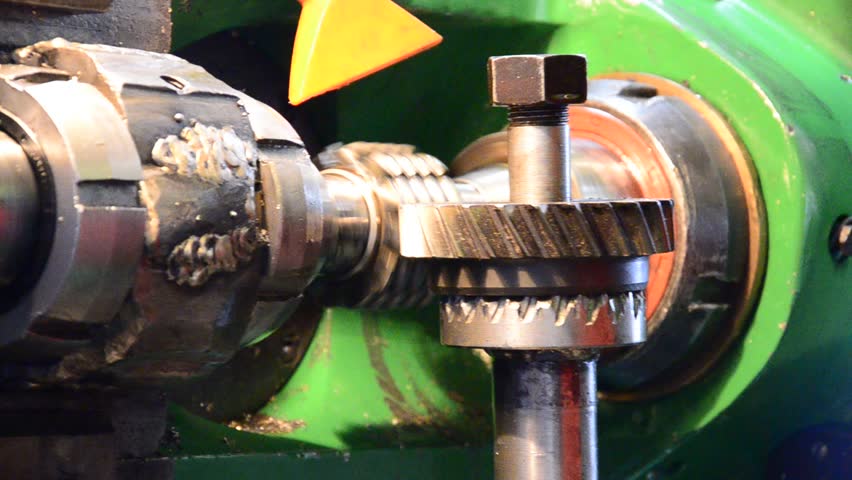 cogwheel  production and service industrial machine, rotating gears lower view