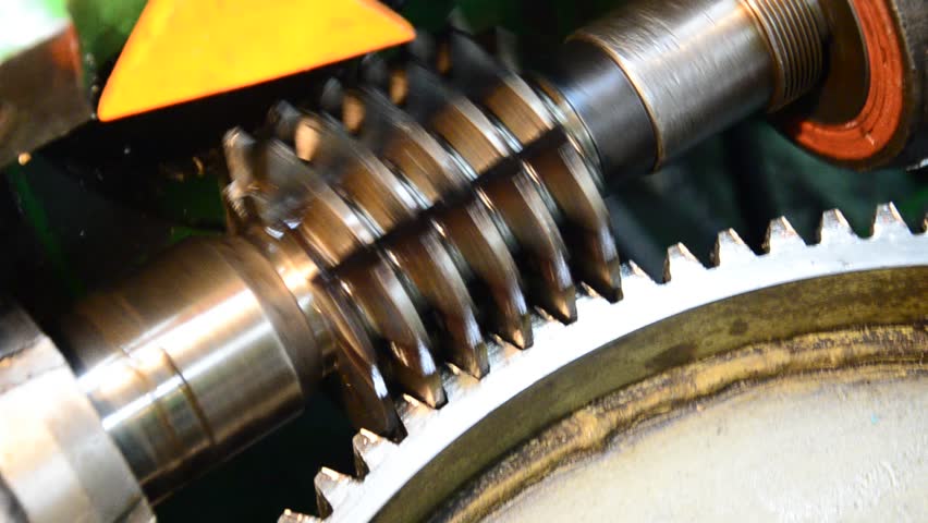 wormwhee gear, cogwheel production and service industrial machine, rotating gears extreme closeup view
