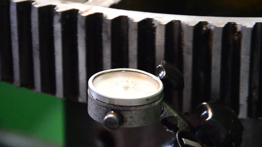 dial gauge instrument measures inclination of cogwheel gear ready for service