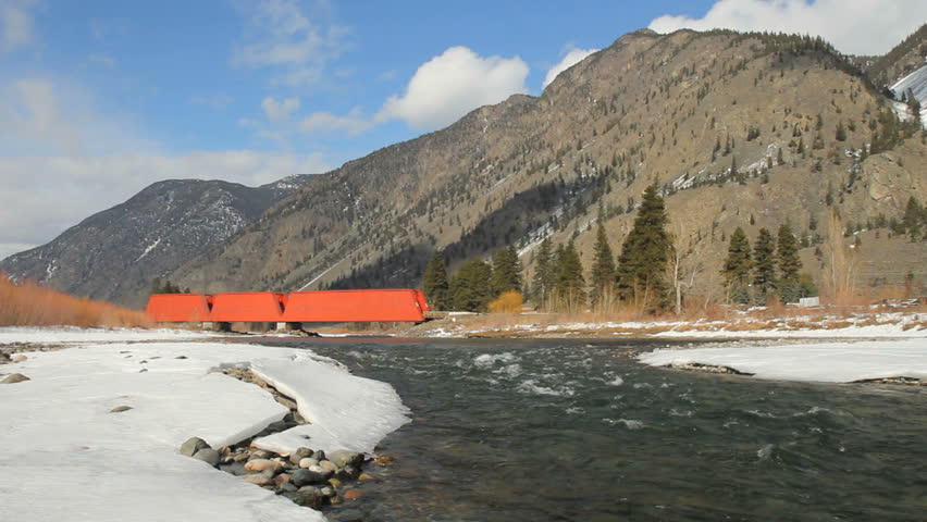 Red Bridge, Keremeos, British Columbia. A red, covered bridge which crosses the Similkameen River near Keremeos. Originally a rail bridge built in 1907. British Columbia, Canada.