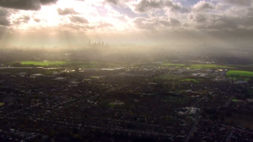 Panoramic and dramatic aerial view over the outskirts of London, England where the sprawling urban metropolis meets  the countryside. 