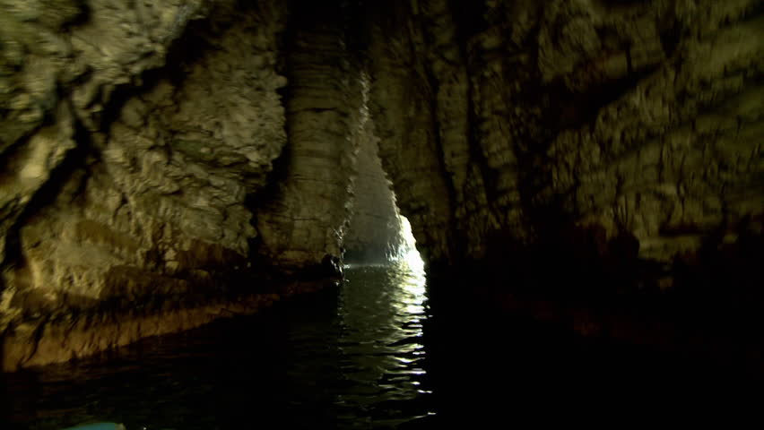 POV from small boat going cave in Raweche rocks