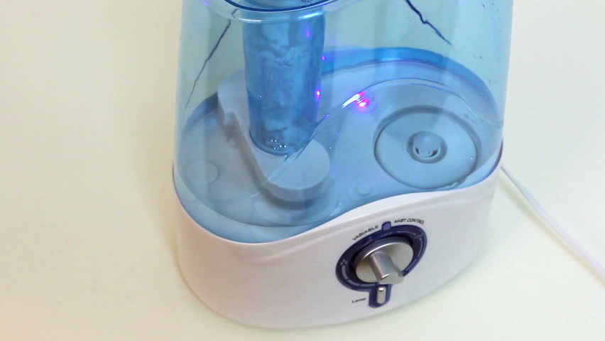Air humidifier. Steam evaporation. Water drops on its surface.
