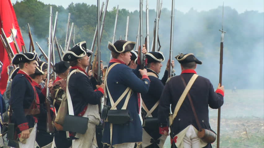 VIRGINIA - OCTOBER 2009 - large-scale, epic American Revolutionary War anniversary reenactment -- in the middle of battle.   Continental Army infantry volleys and fires in line of battle - Militia.