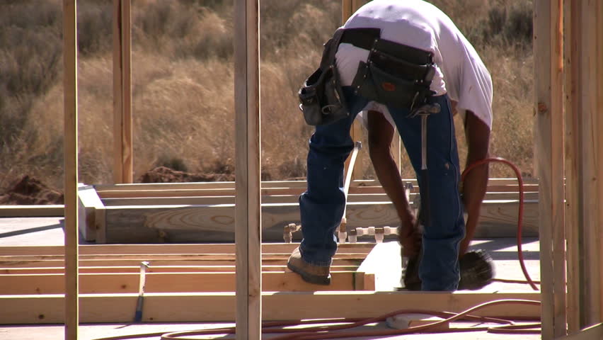 Using hammers on a construction site.