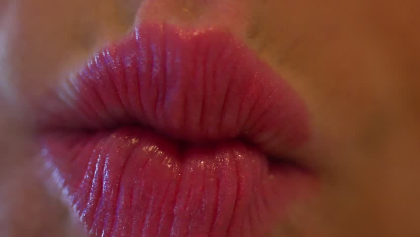 Kisses
An extreme close up shot of lips making kissing faces. 