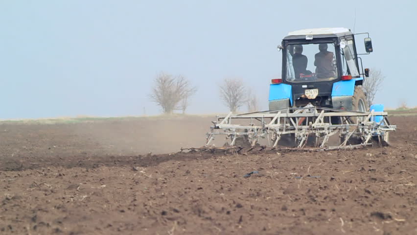 Tractor working on the filed.