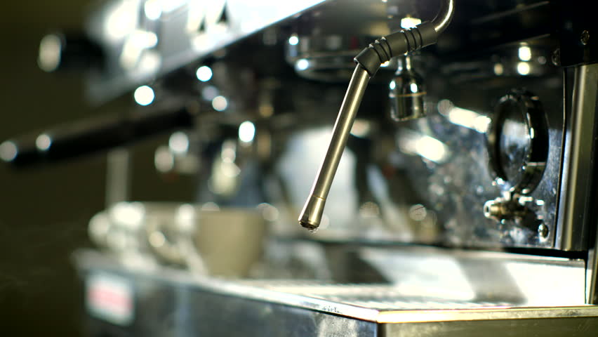 Burst of coffee from coffee machine    